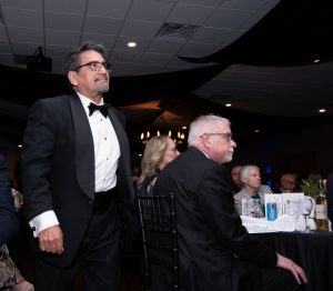 Jorge Ruiz, DDC VP approaches the dais to introduce the Dallas Clergy