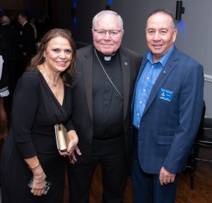 Sandra Mediano with Bishop Edward Burns and her husband Omar Mediano